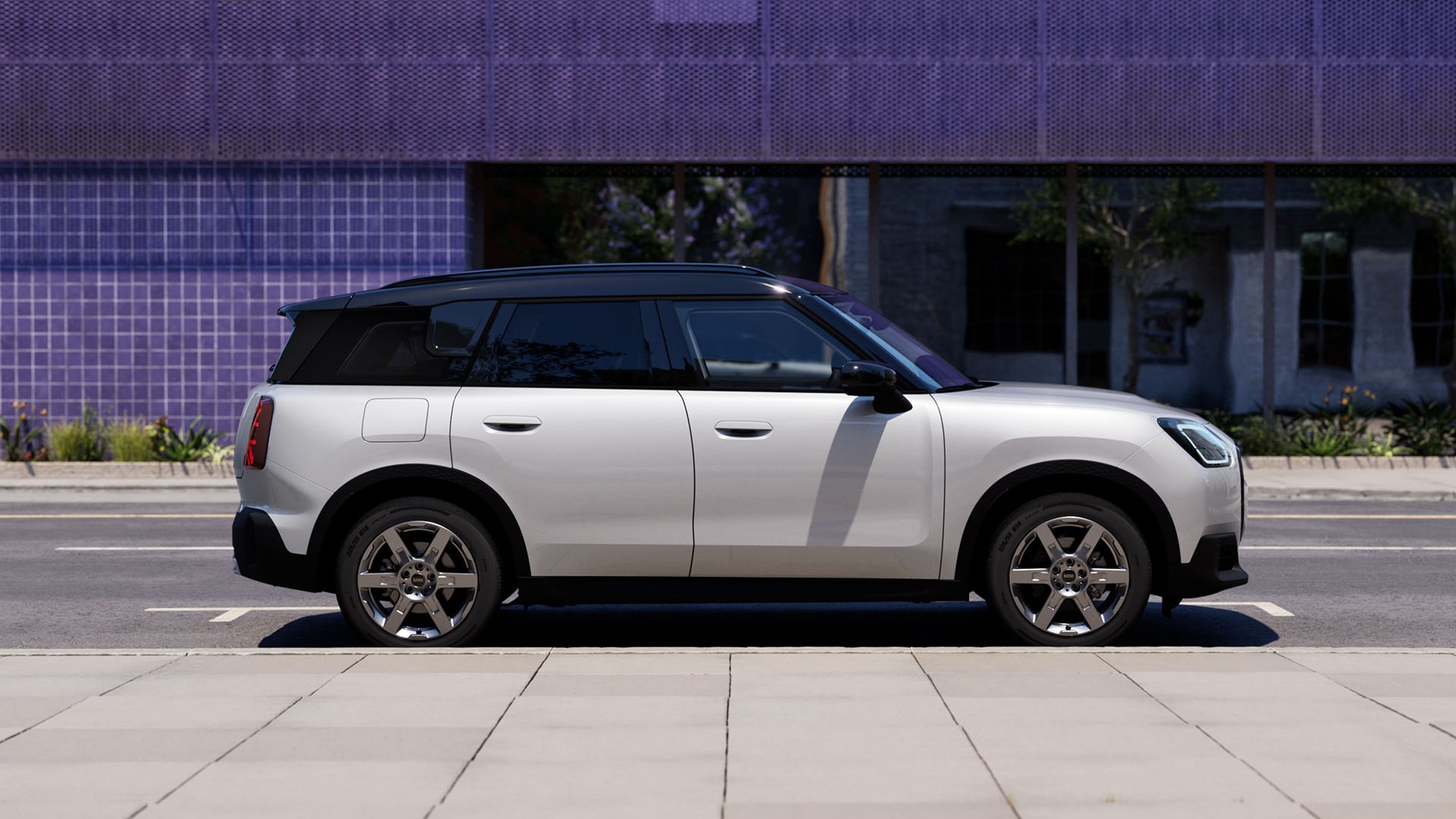 MINI Countryman parked off-road near hills